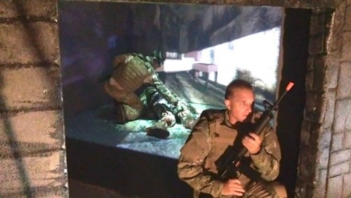 Breaking down walls: The ETLab has specialized in creating highly realistic 3-D simulations in its VisCube for clients such as Air Force pararescue teams (above). Sensor vests, wireless 3-D goggles and other advances could soon bring these simulations out into the real world.