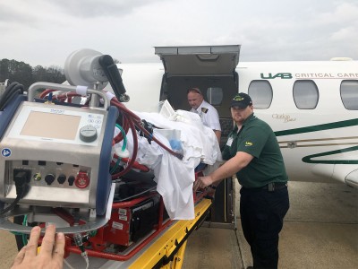 UAB's Critical Care Transport team puts Michelle into the jet to bring her to Birmingham on Christmas Eve. Michelle will board the plane again Thursday, March 31, to head back home to Chicago. (UAB Media)