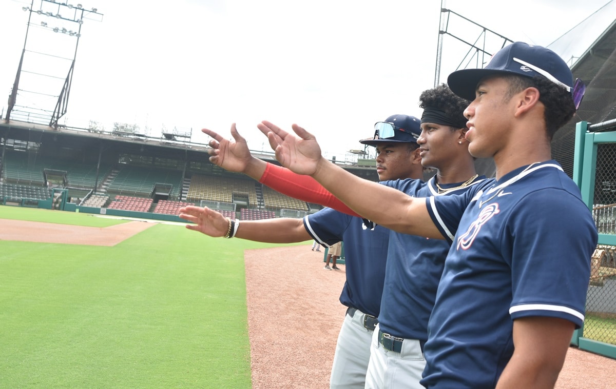 Three Breakthrough Series players take in the scenery inside Rickwood Field. (Solomon Crenshaw Jr. / Alabama News Center)