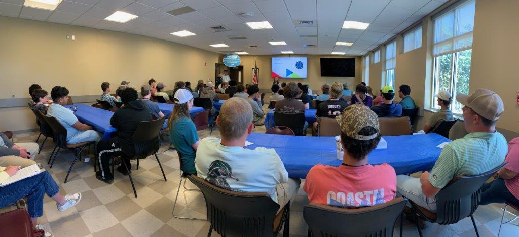 Students receive a welcome from Brooke Goff, Alabama Power community relations specialist, at Headland career day. (Teisha Wallace / Alabama News Center)
