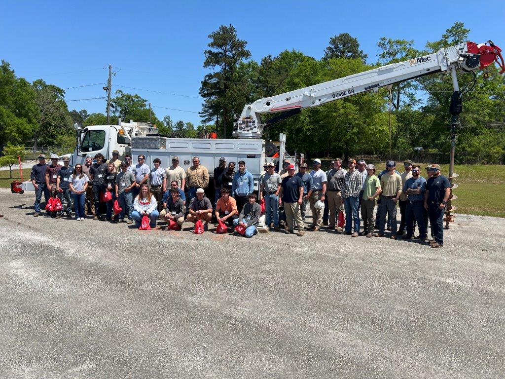 Group photo of participants and Alabama Power employees at Phenix City Lineworker Career Day. (Brooke Goff / Alabama News Center)